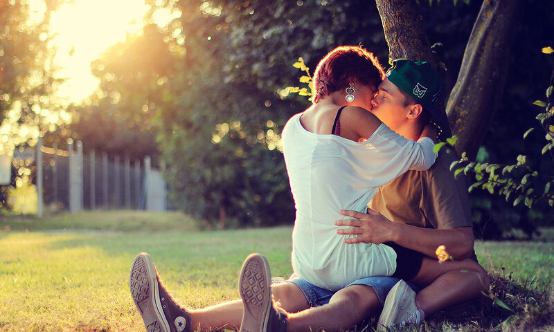 Couple Kissing on Grass — Green, Romantic, Sunset