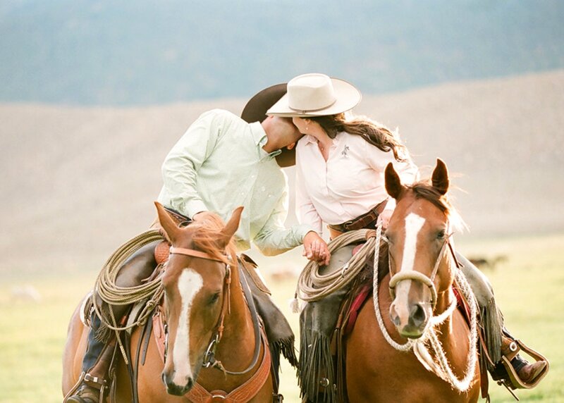 Couple Kissing on Horses — Brown
