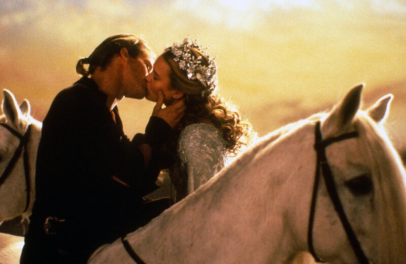 Couple Kissing on Horses