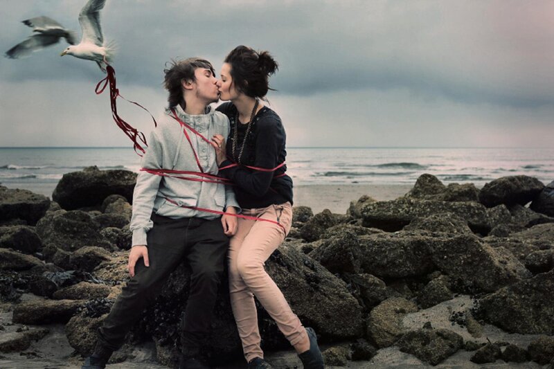 Couple Kissing on Rocks — Gray