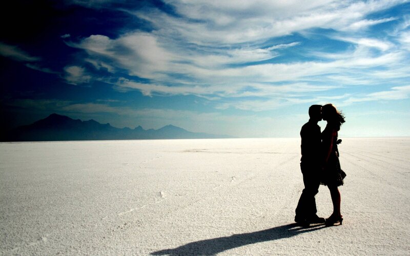 Couple kissing on salt flat