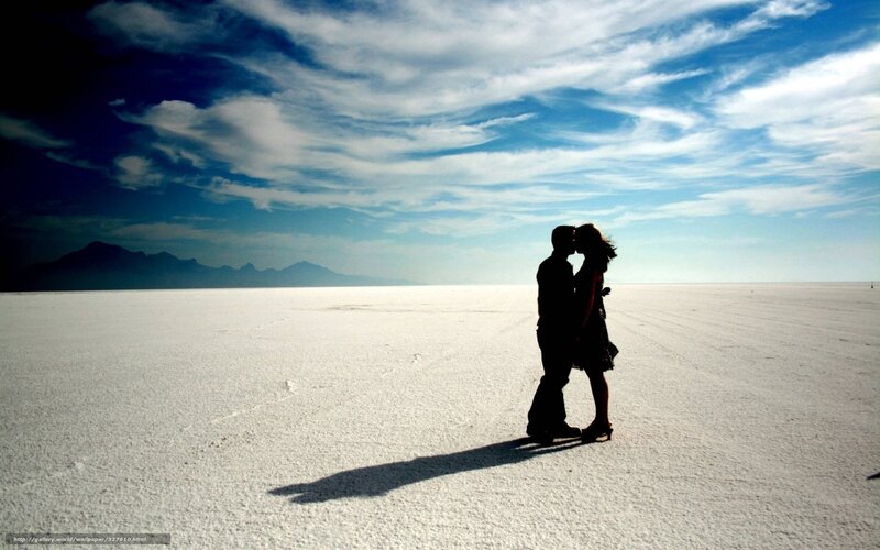 Couple kissing on salt flat