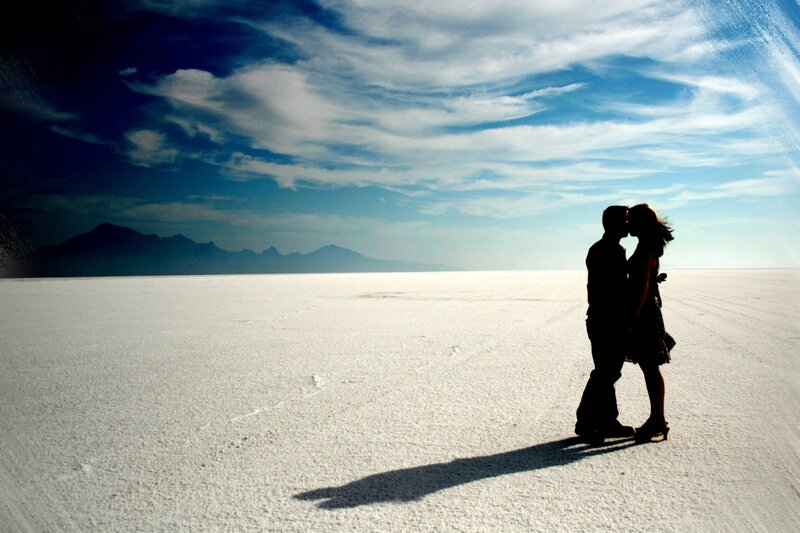 Couple Kissing on Salt Flat — White, Dramatic