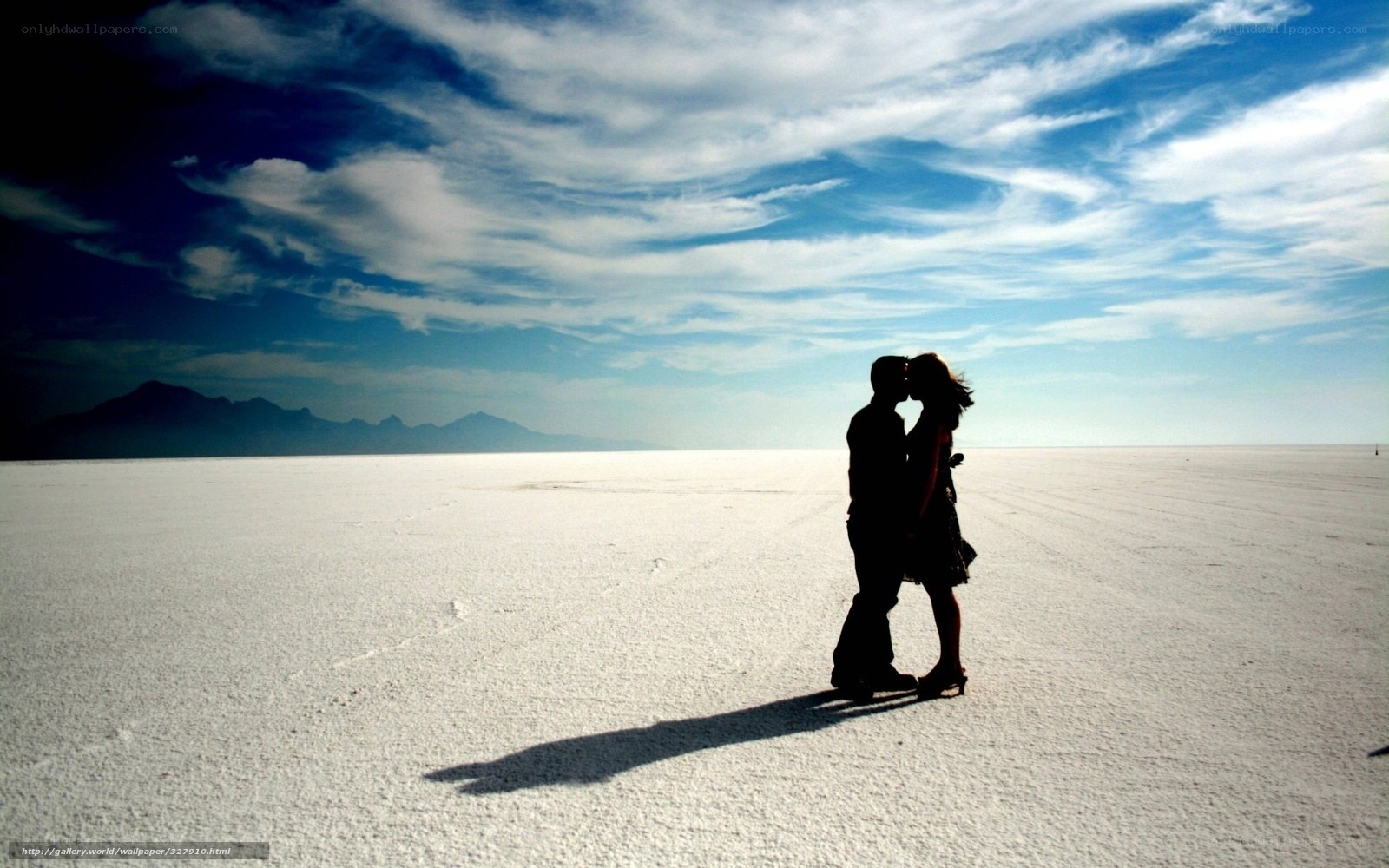 Couple kissing on salt flat