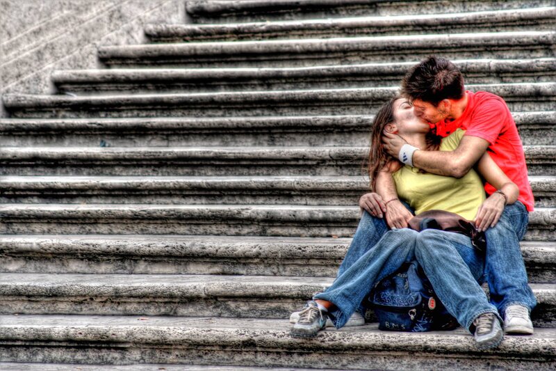 Couple kissing on stairs