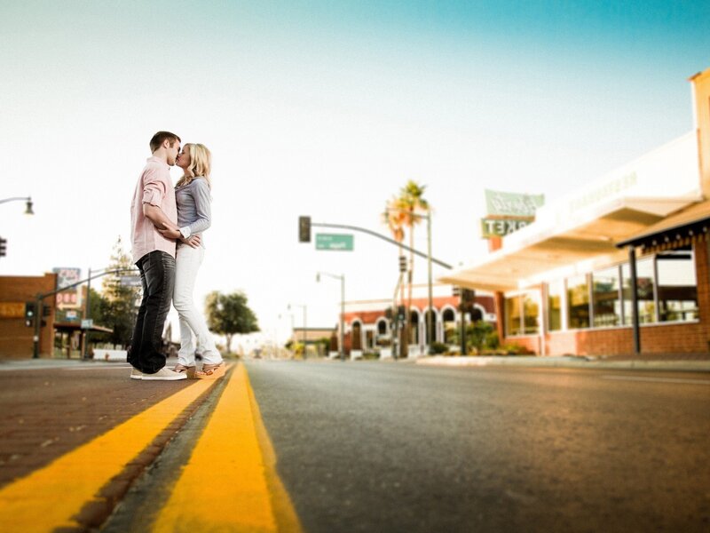 couple kissing on street