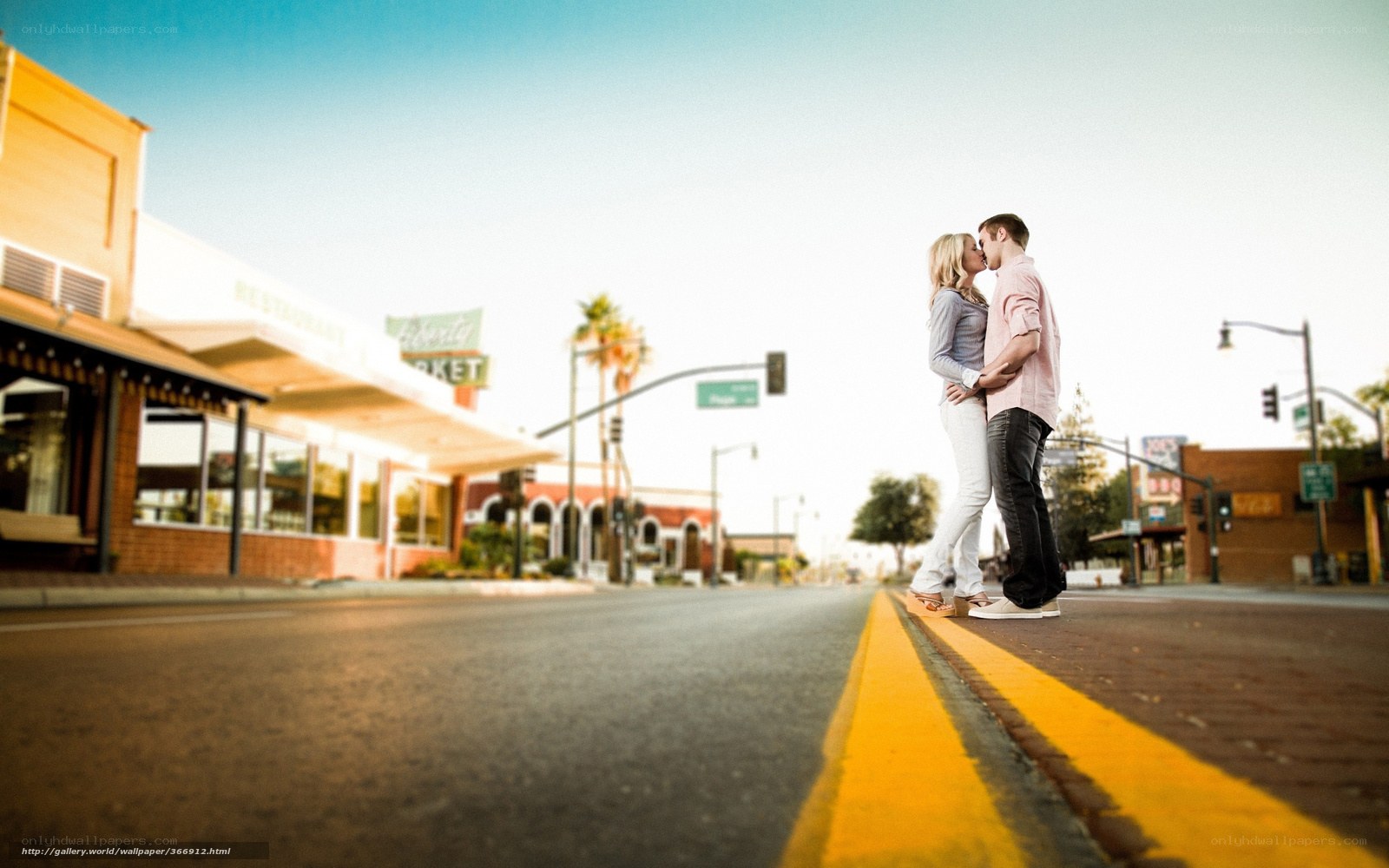 Couple kissing on street corner