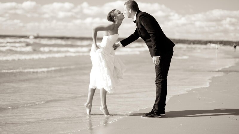 Couple kissing on the beach