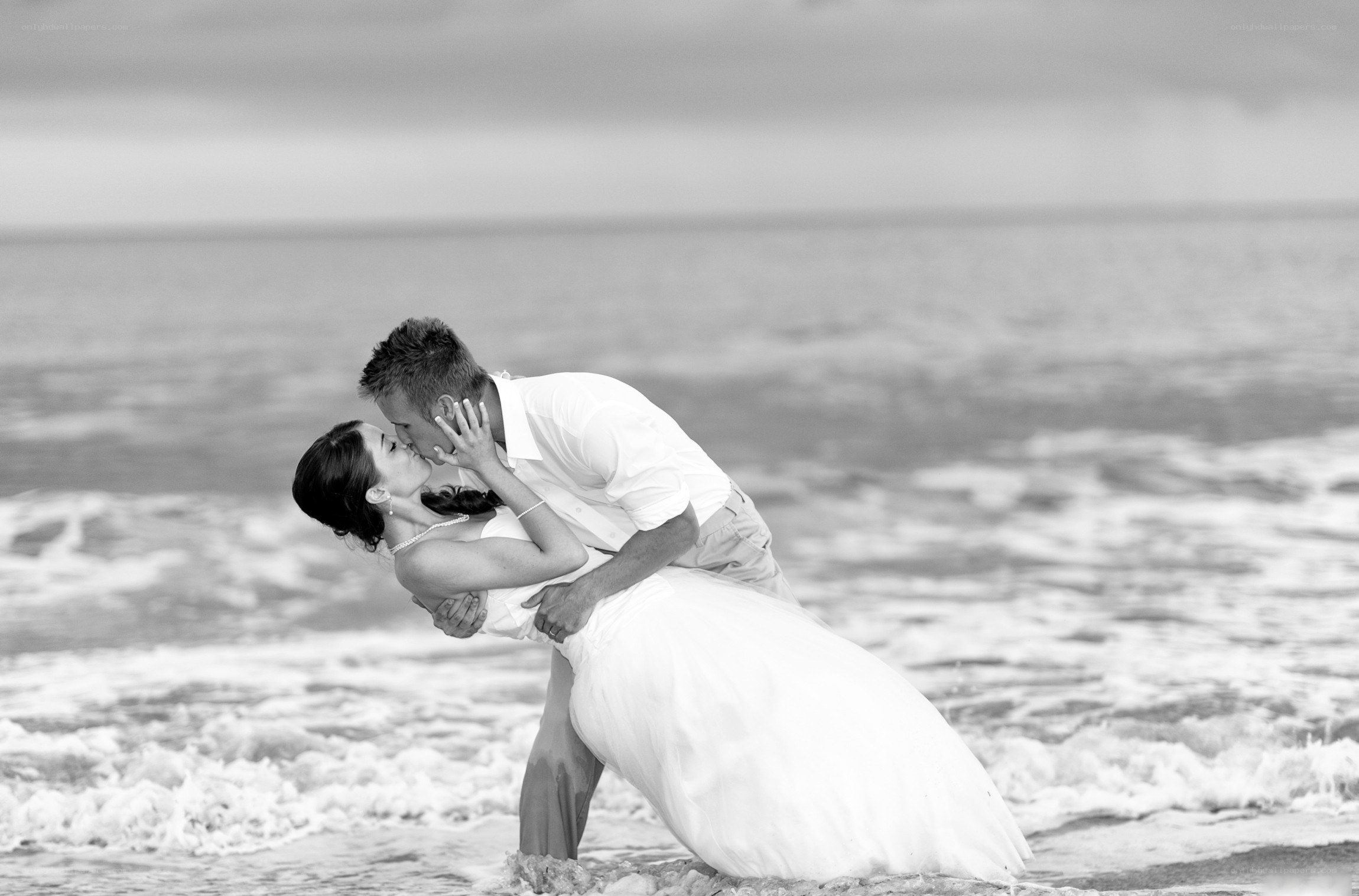 Couple kissing on the beach