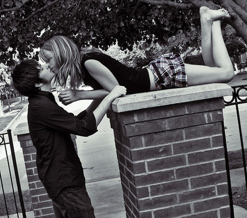 Couple Kissing on Wall — Black, Romantic, Afternoon
