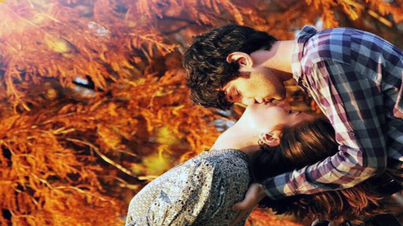 Couple Kissing Outdoors — Orange