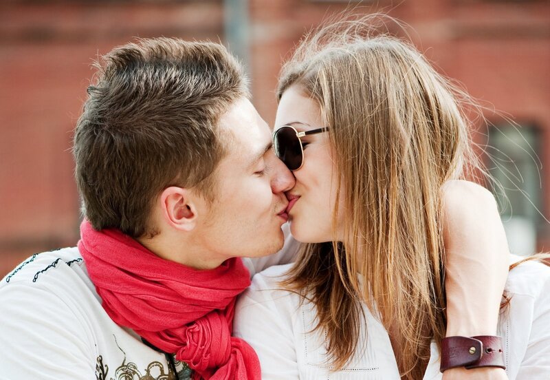 Couple Kissing Outdoors — White