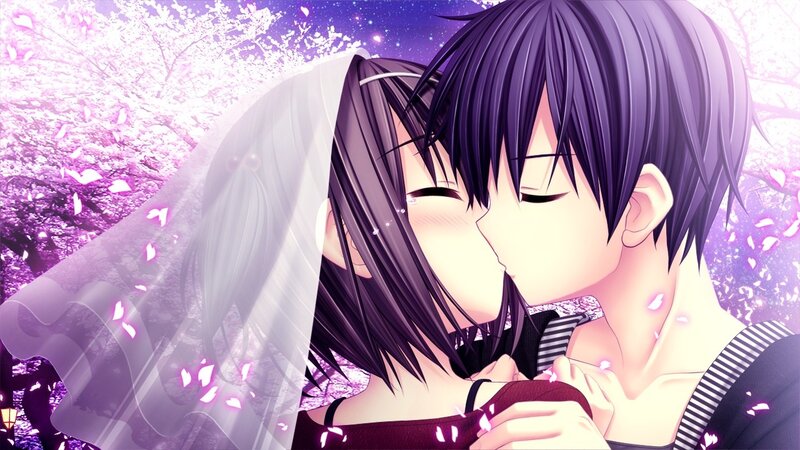 couple kissing under cherry blossoms