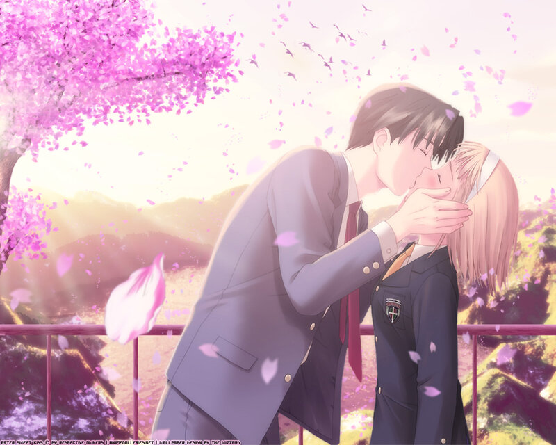 couple kissing under cherry blossoms
