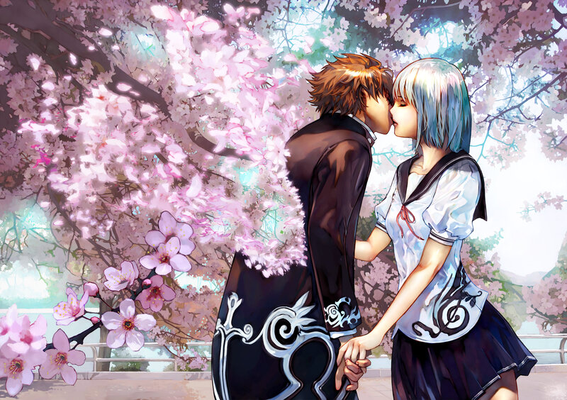 couple kissing under cherry blossoms
