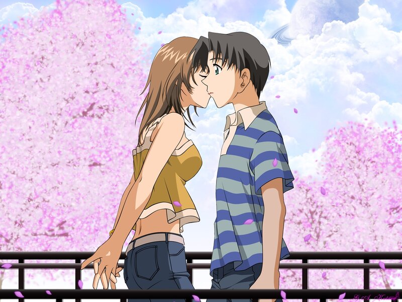 couple kissing under cherry blossoms