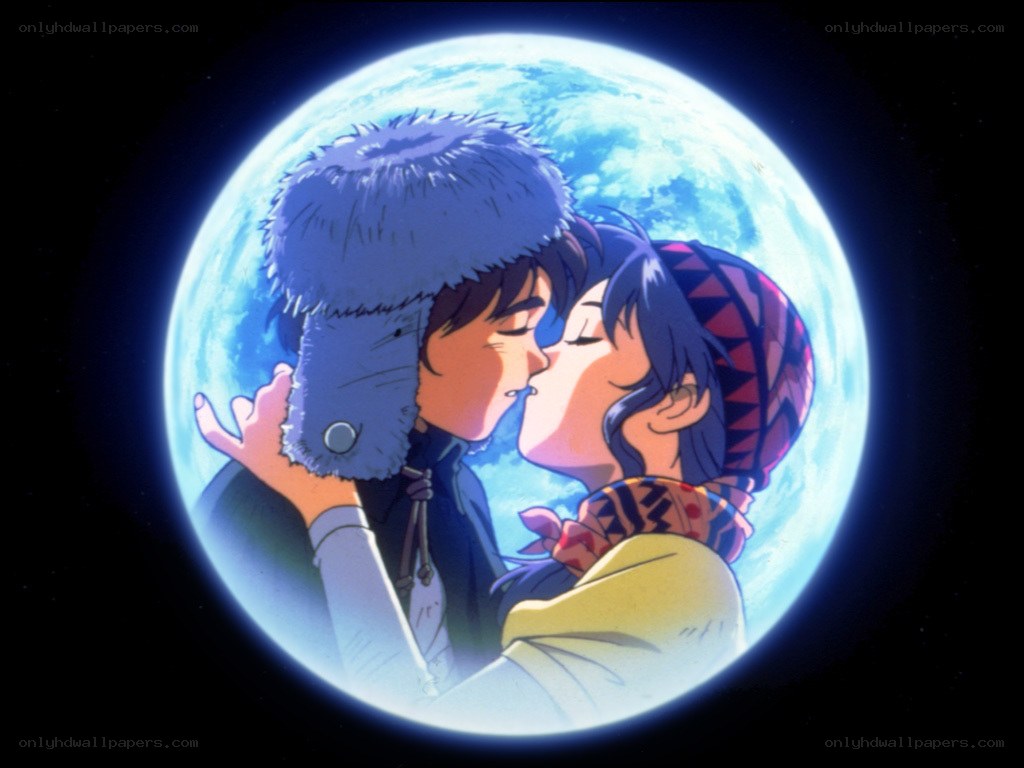 couple kissing under moon