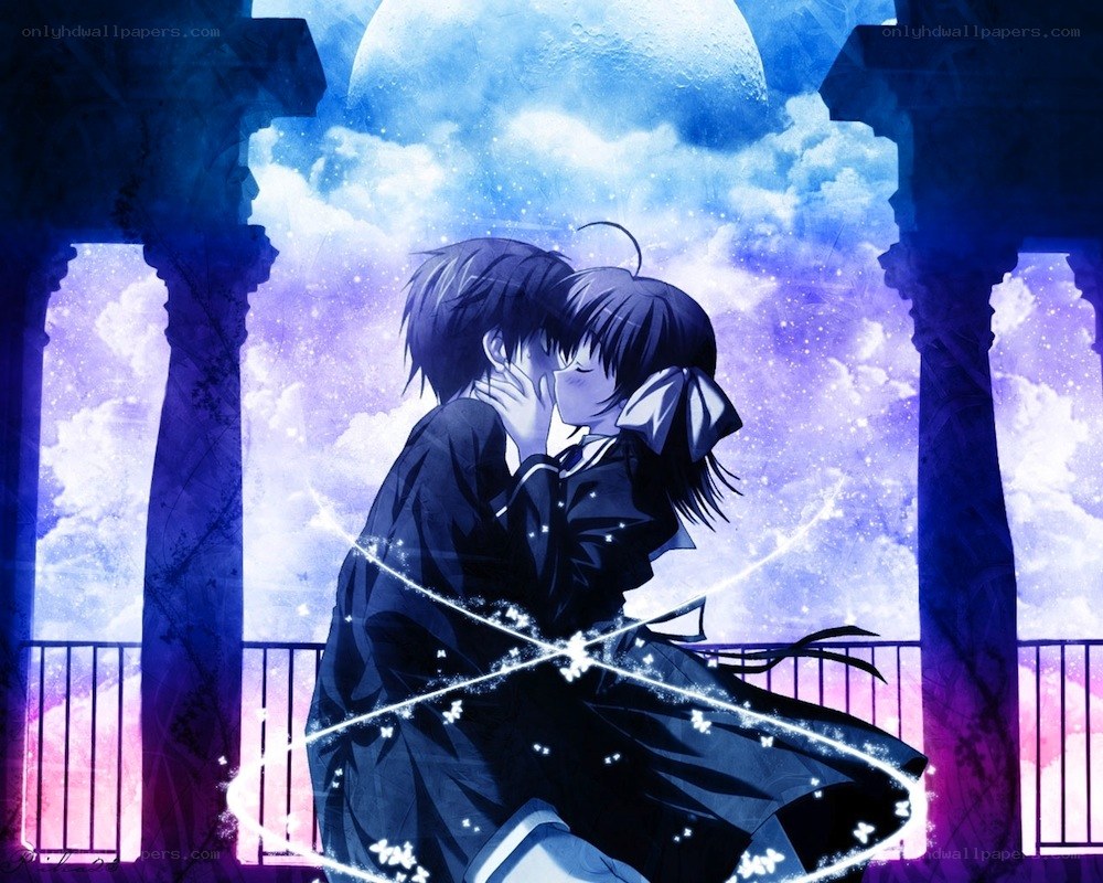couple kissing under moonlight