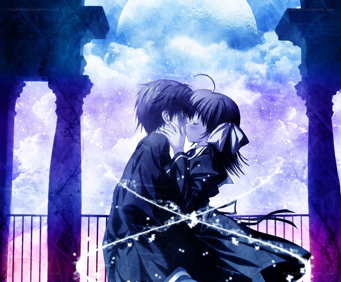 couple kissing under moonlight