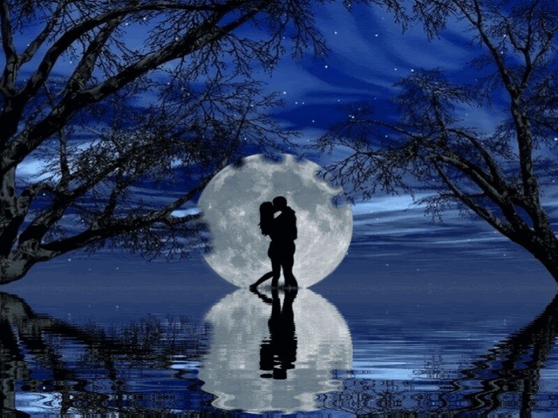 Couple kissing under moonlight