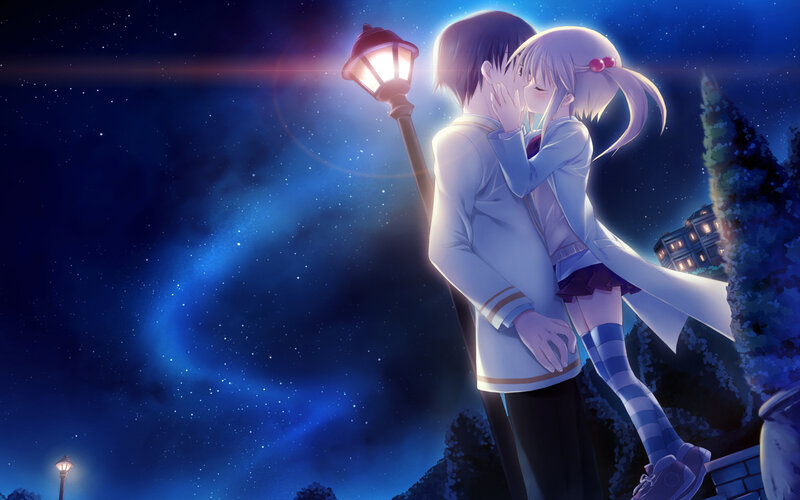 couple kissing under streetlight