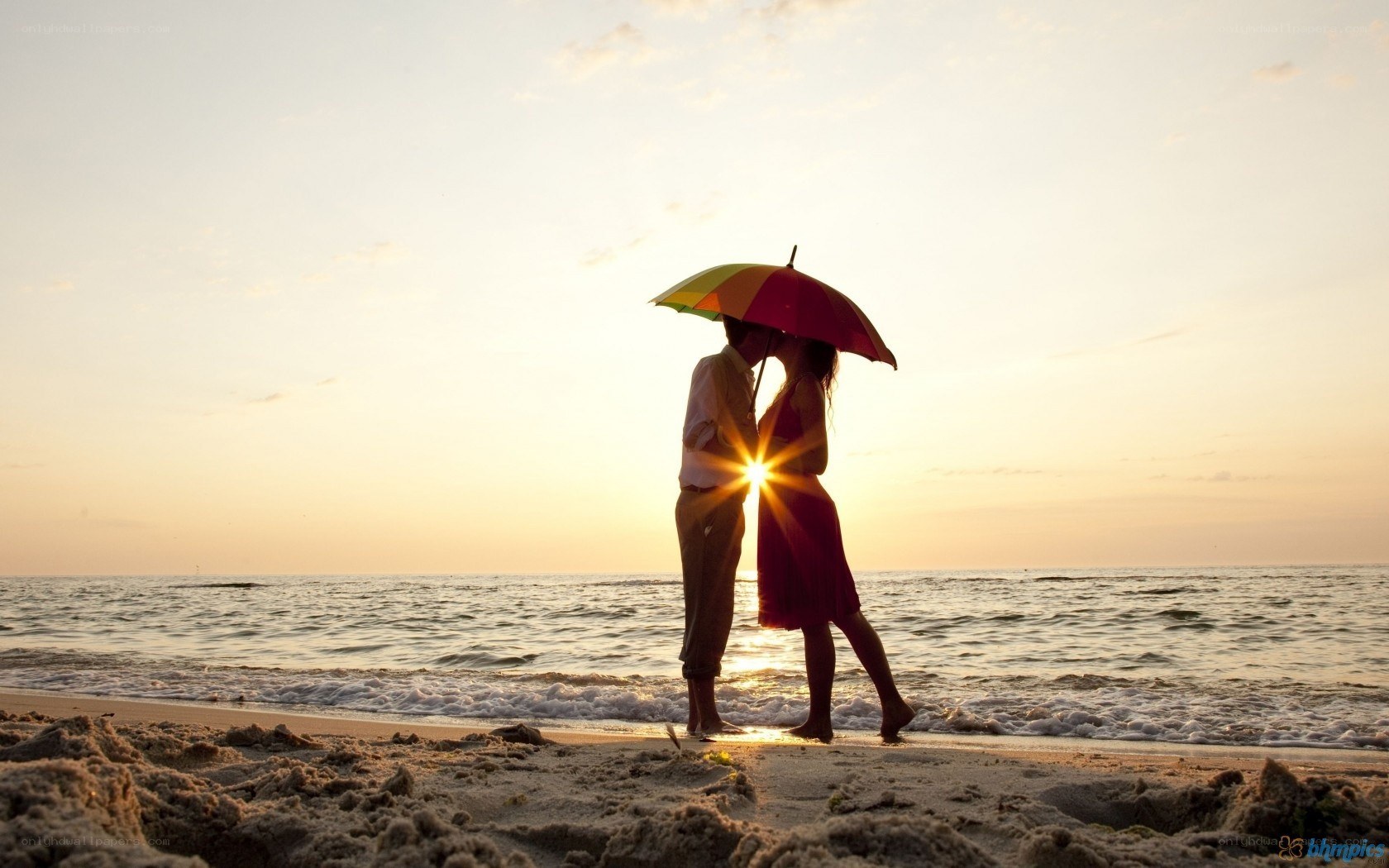 Couple kissing under umbrella