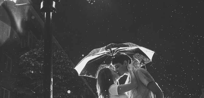 Couple Kissing under Umbrella — Black
