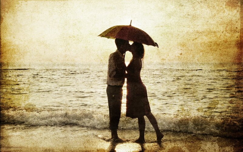 Couple Kissing under Umbrella — Brown