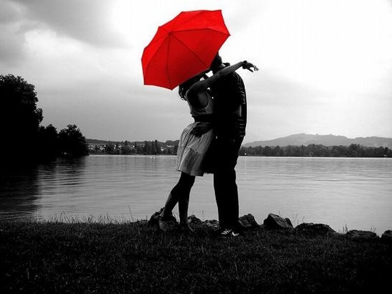 Couple Kissing under Umbrella — Red