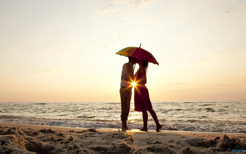 Couple Kissing under Umbrella — Yellow