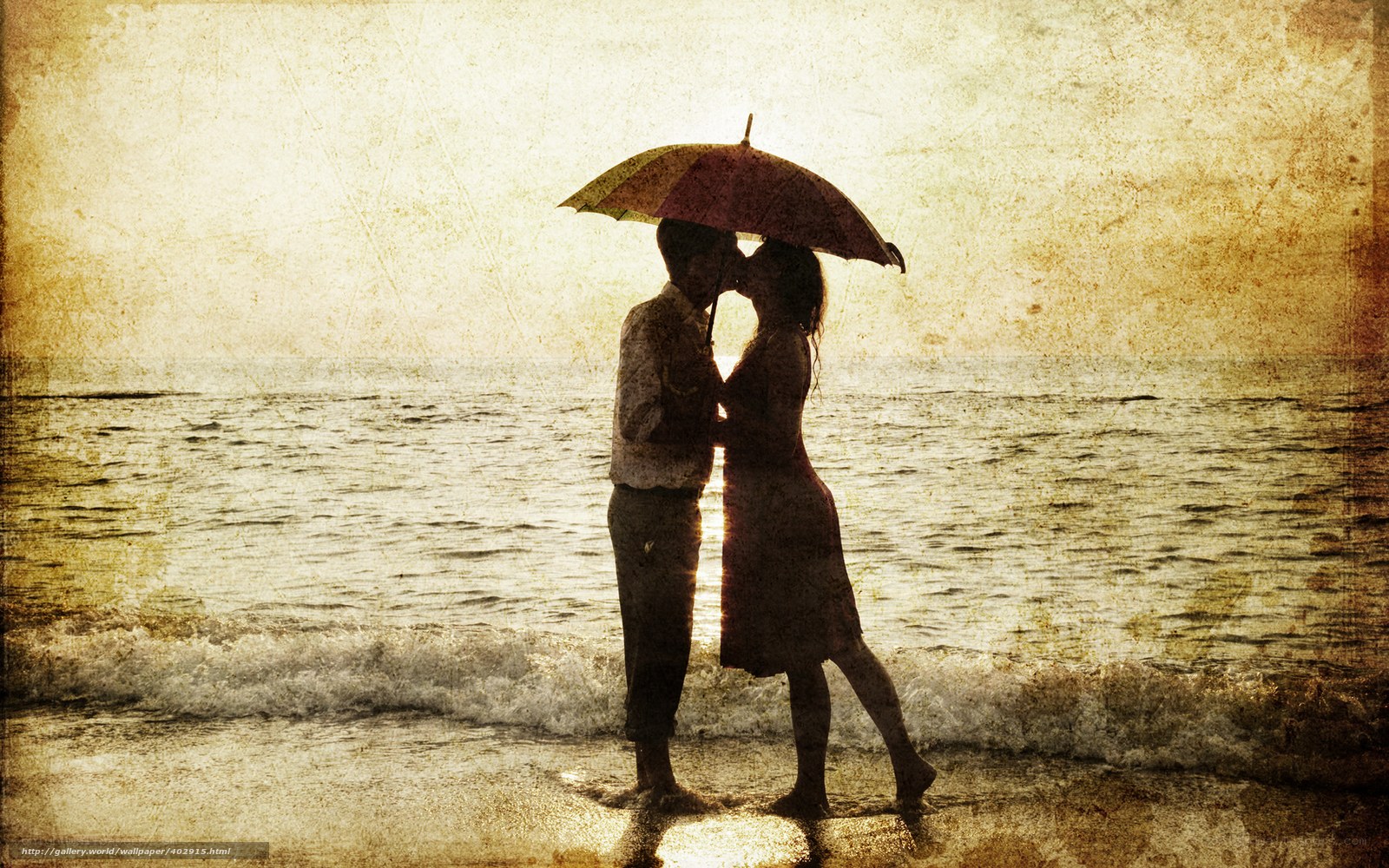 Couple kissing under umbrella