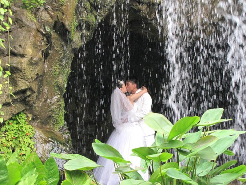 Couple Kissing under Waterfall