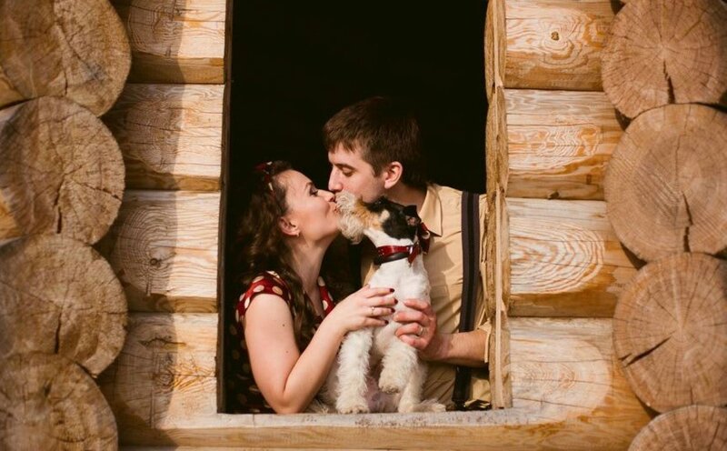Couple Kissing with Dog
