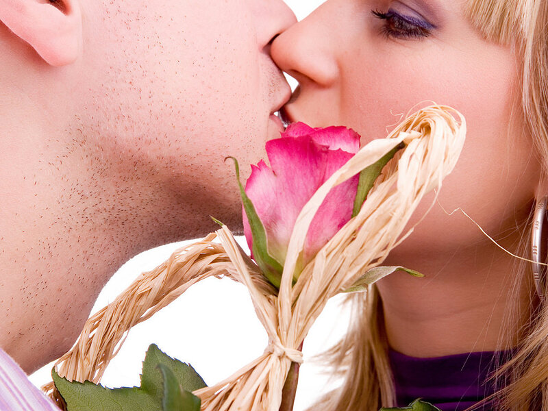 Couple Kissing with Rose