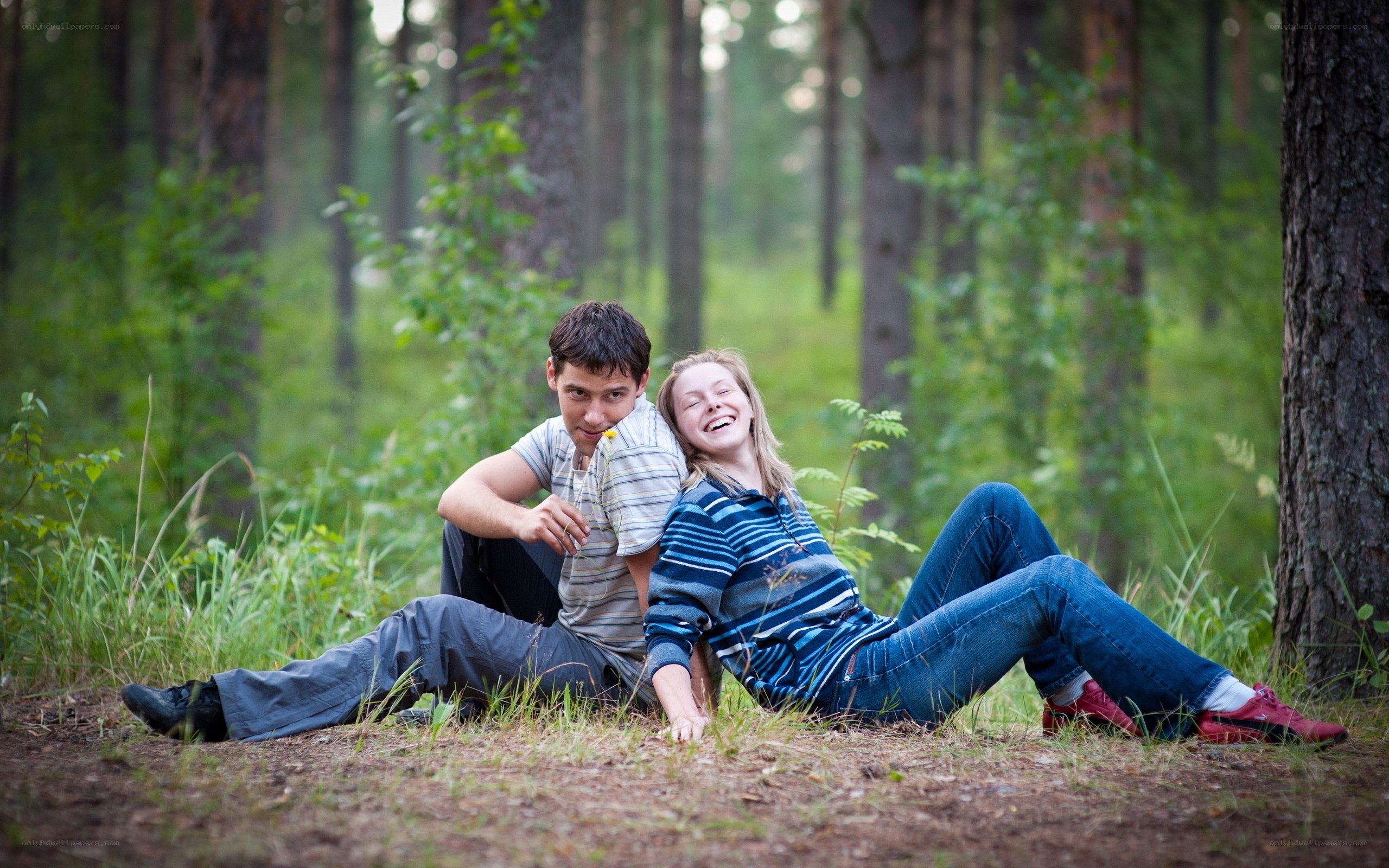 Couple laughing in the forest