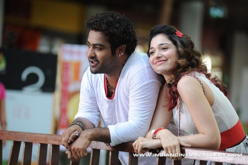 couple leaning on railing