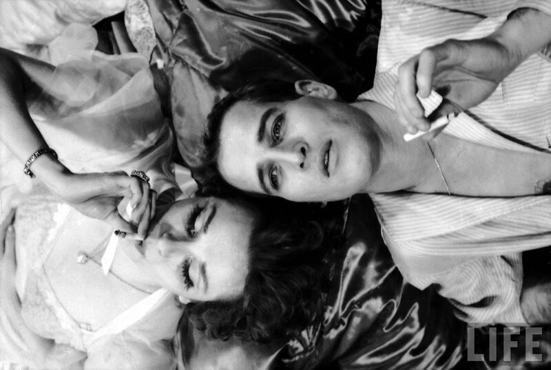 Couple lying in bed together