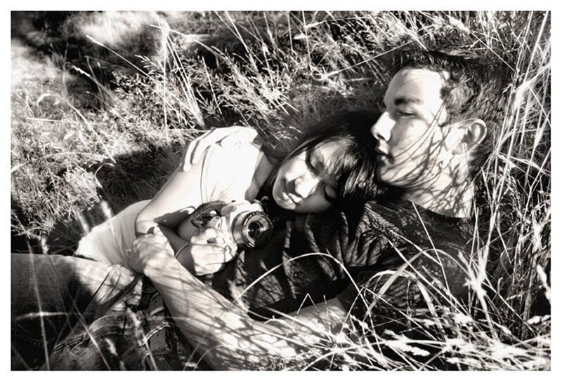 Couple Lying in Grass — Black, Peaceful