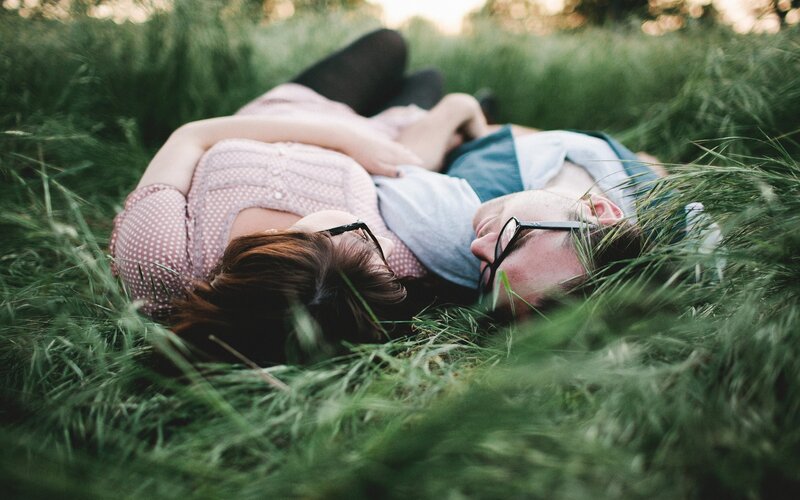 Couple Lying in Grass — Green, Peaceful, Sunset
