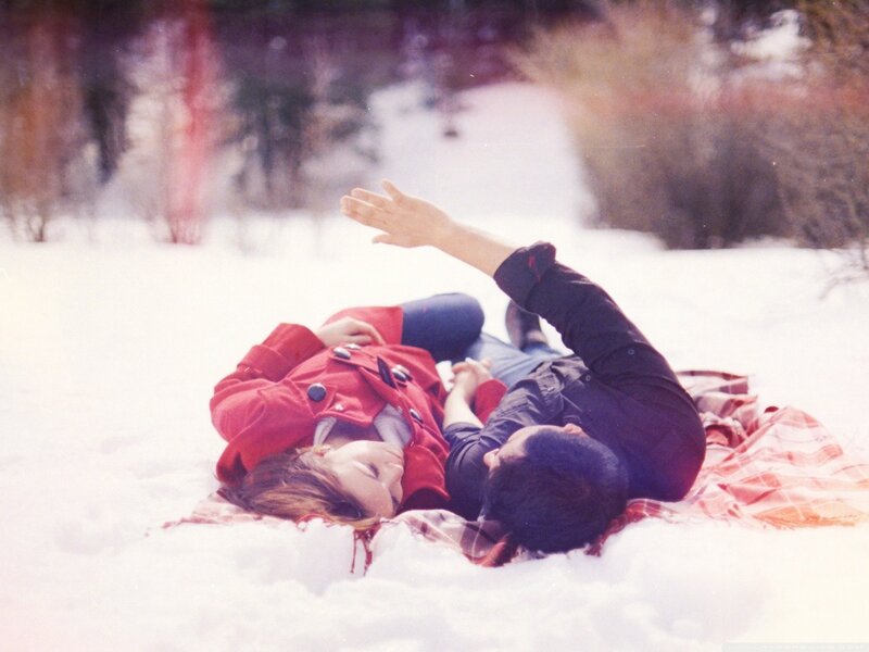 Couple lying in the snow