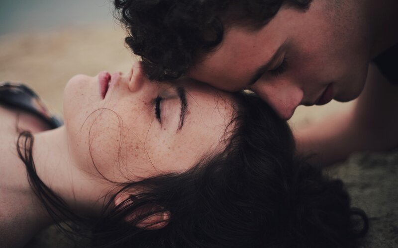 Couple Lying on Beach — Brown, Intimate, Sunset