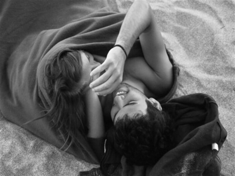 Couple Lying on Sand — Black
