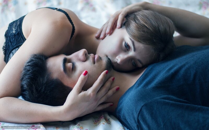 Couple lying together intimately