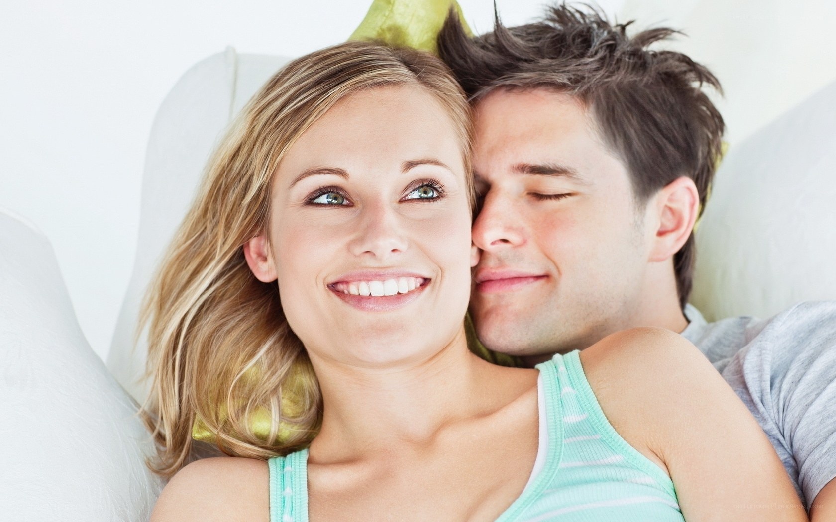 Couple lying together on couch
