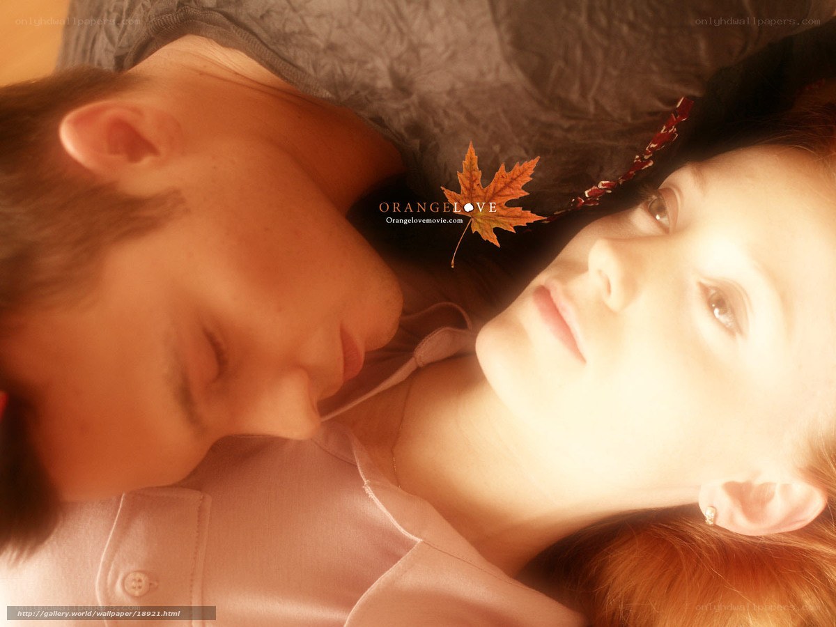 Couple lying together with leaf