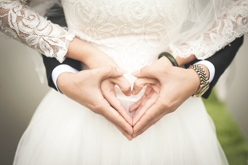 Couple making heart shape