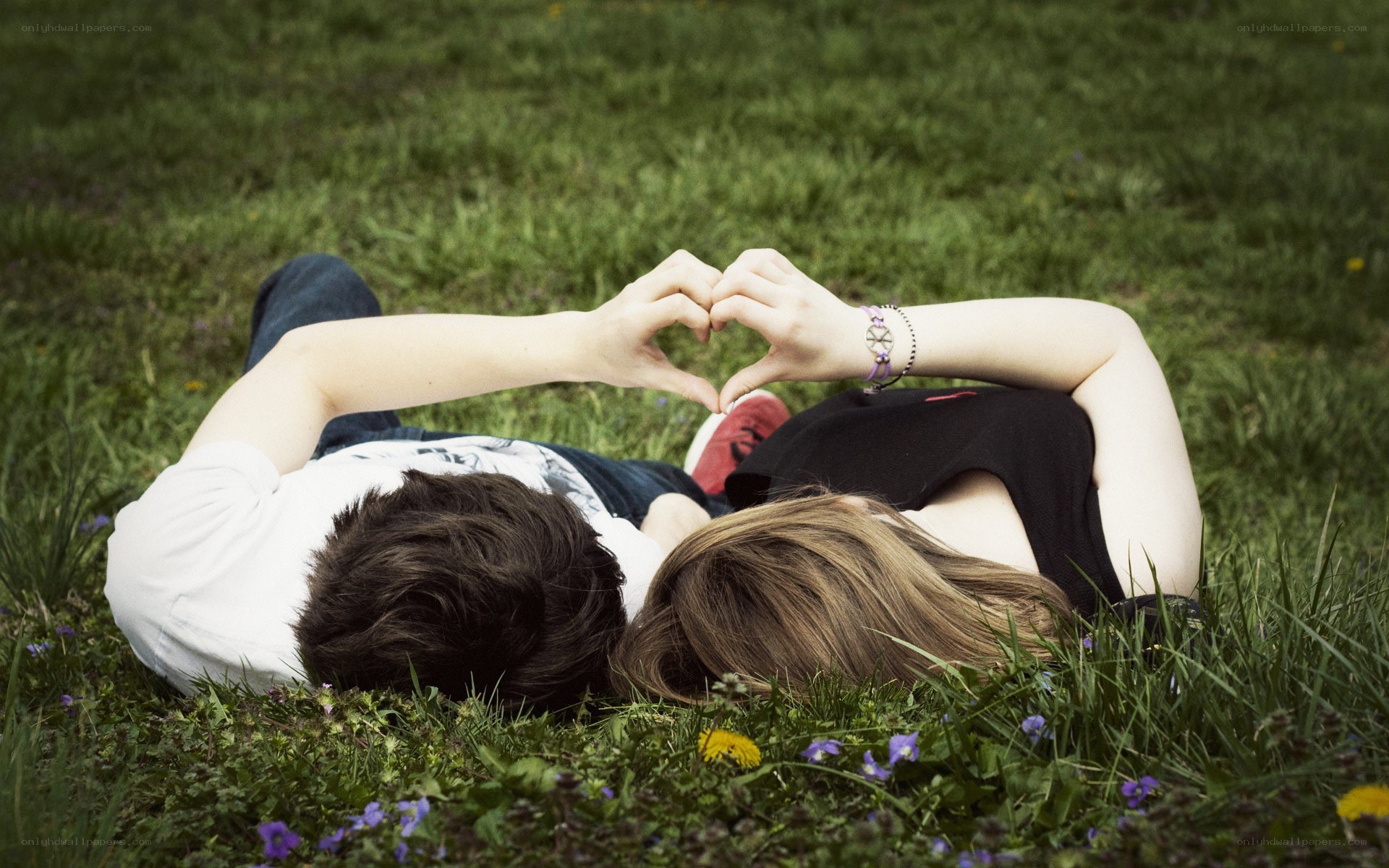 Couple making heart shape