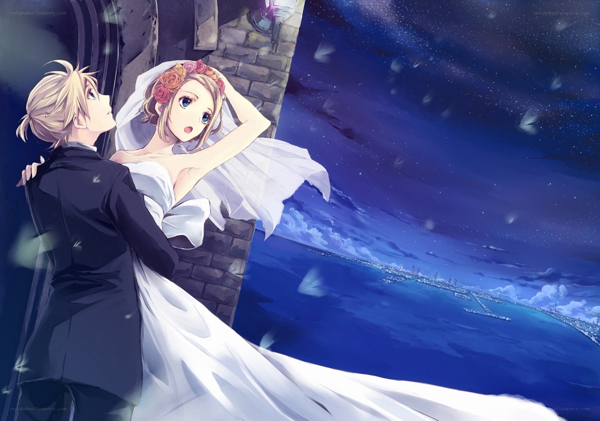 couple on a balcony at night
