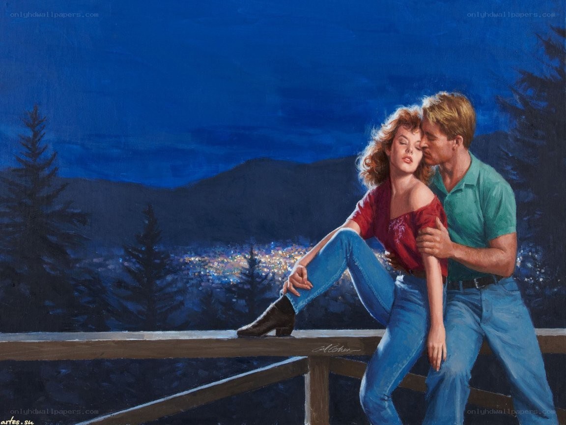 Couple on a balcony at night