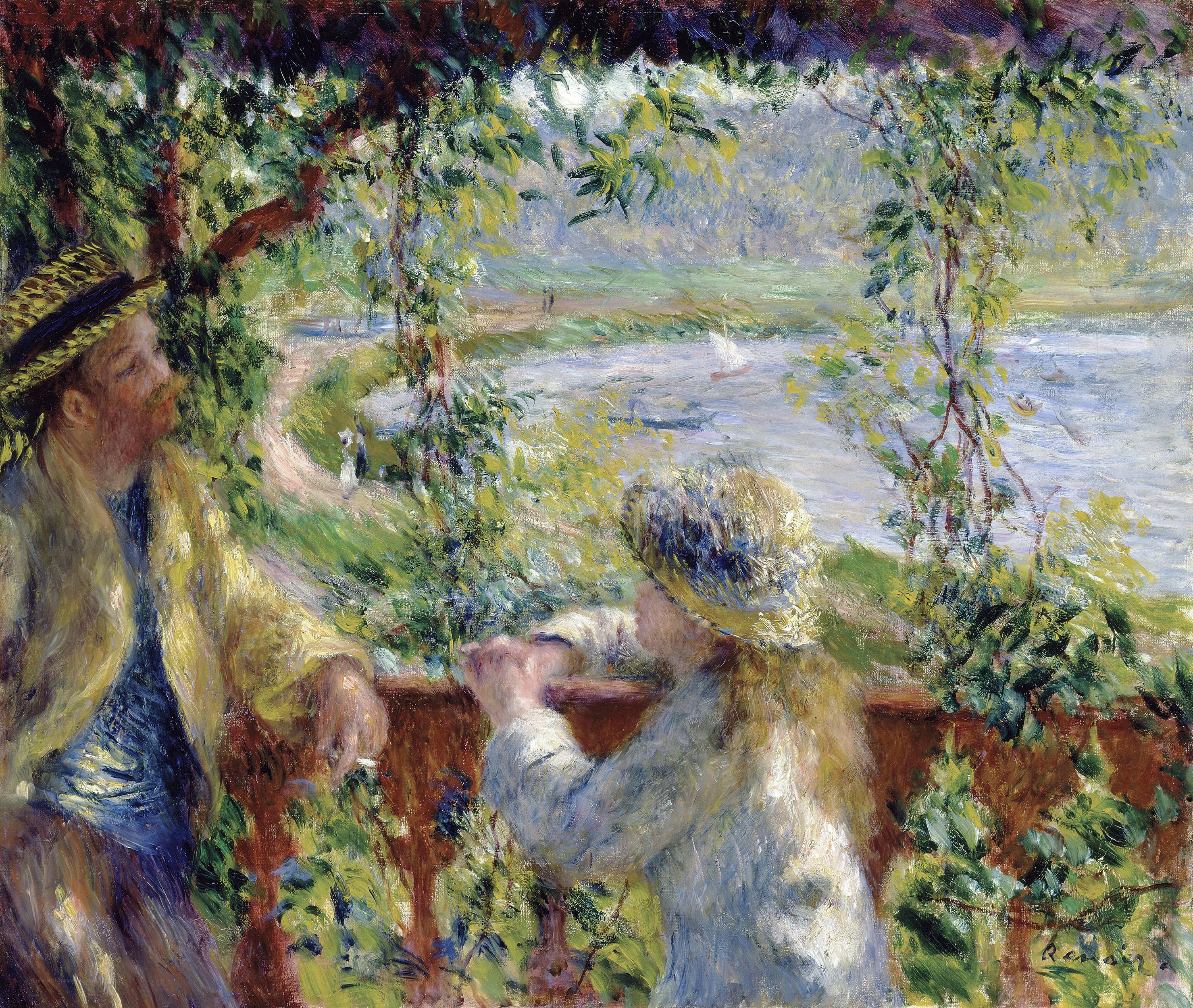 Couple on a balcony overlooking the river